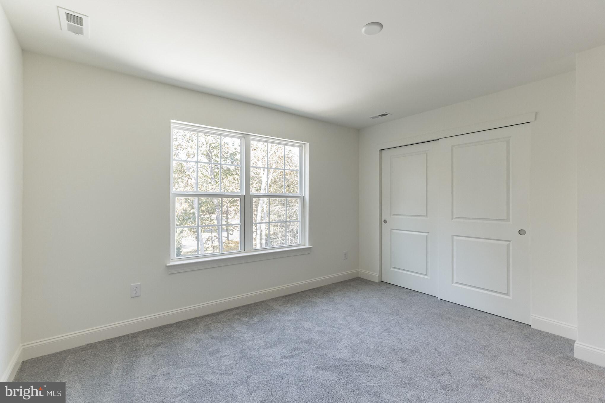 317 Ferrell Road Mullica Hill, NJ 08062 - Photo 26 of 31 a view of an empty room with a window