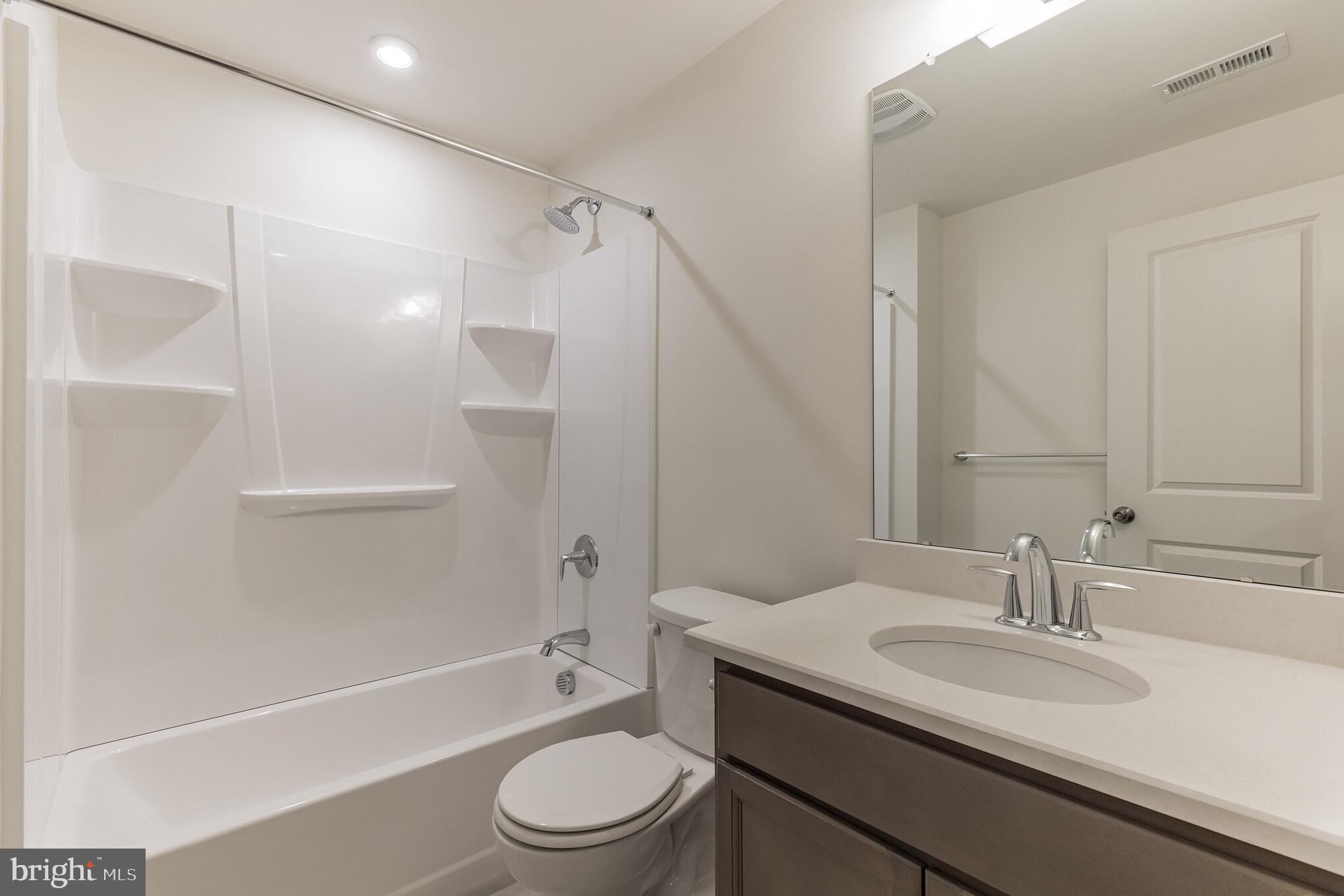 317 Ferrell Road Mullica Hill, NJ 08062 - Photo 31 of 31 a bathroom with a granite countertop sink toilet and shower