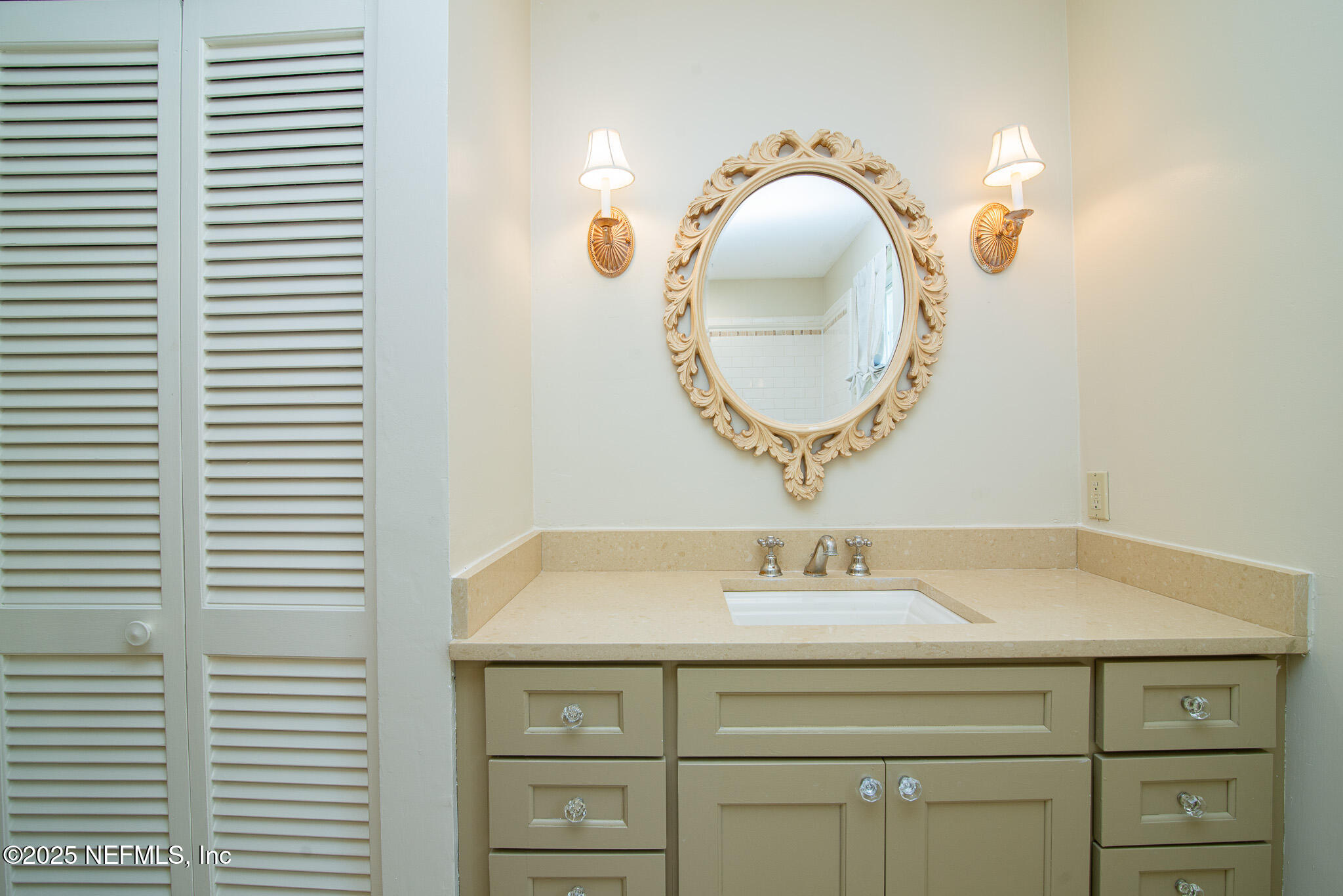 4358 Timuquana Road, Unit 148 Jacksonville, FL 32210 - Photo 14 of 22 a bathroom with a sink and a mirror