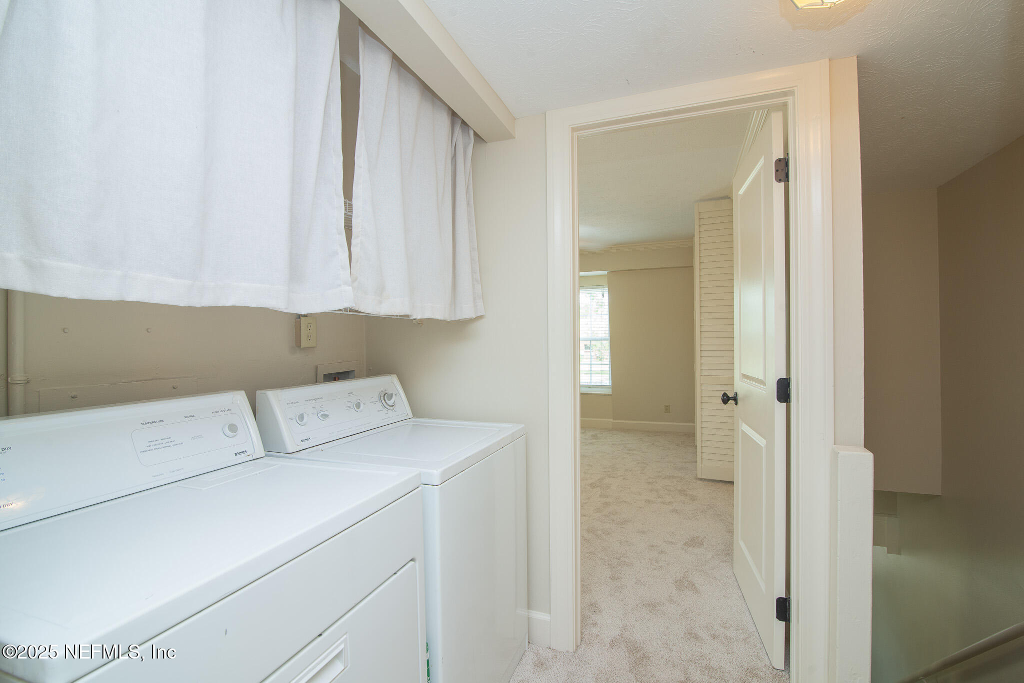 4358 Timuquana Road, Unit 148 Jacksonville, FL 32210 - Photo 16 of 22 a utility room with dryer and washer
