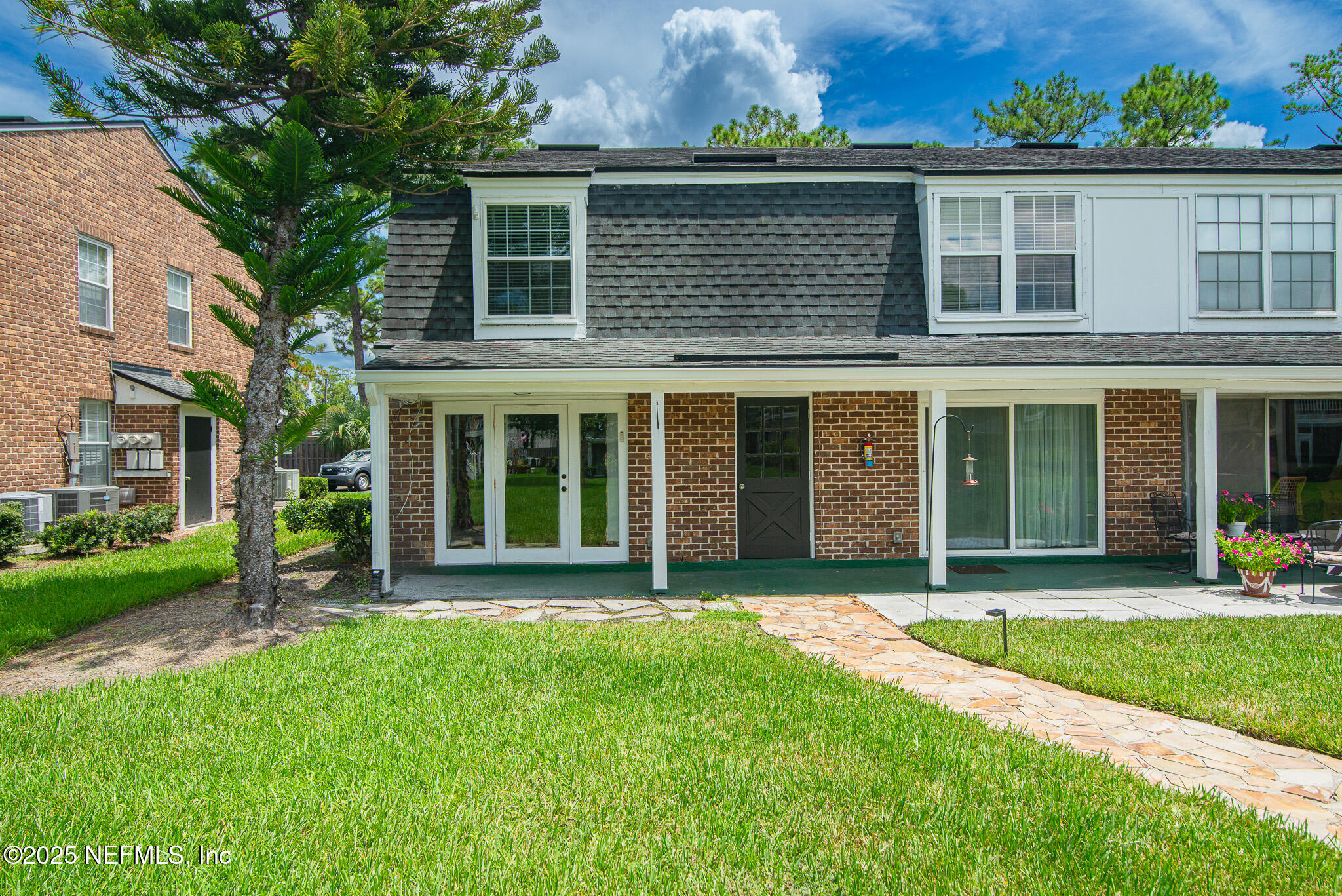 4358 Timuquana Road, Unit 148 Jacksonville, FL 32210 - Photo 17 of 22 front view of a brick house with a yard