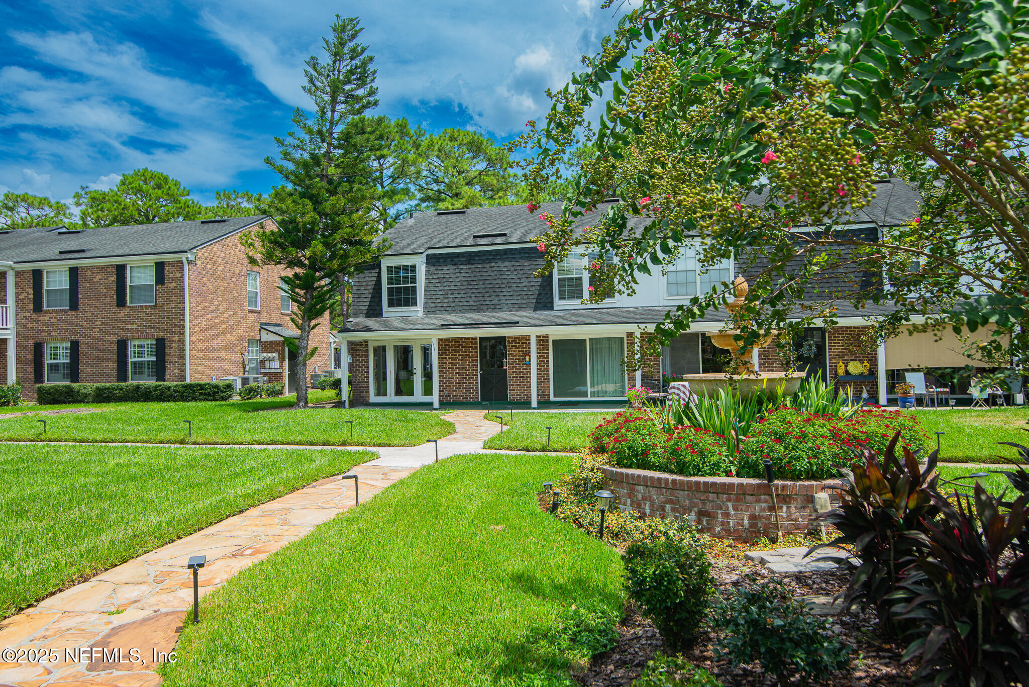 4358 Timuquana Road, Unit 148 Jacksonville, FL 32210 - Photo 20 of 22 a front view of a house with a yard