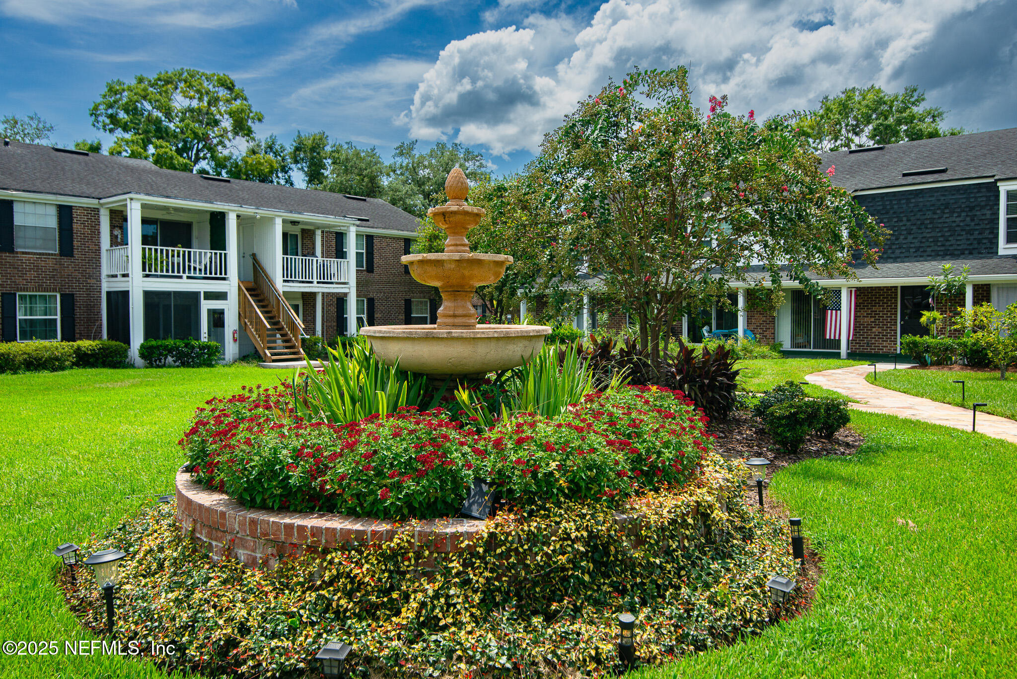 4358 Timuquana Road, Unit 148 Jacksonville, FL 32210 - Photo 2 of 22 a view of a house with backyard sitting area and garden