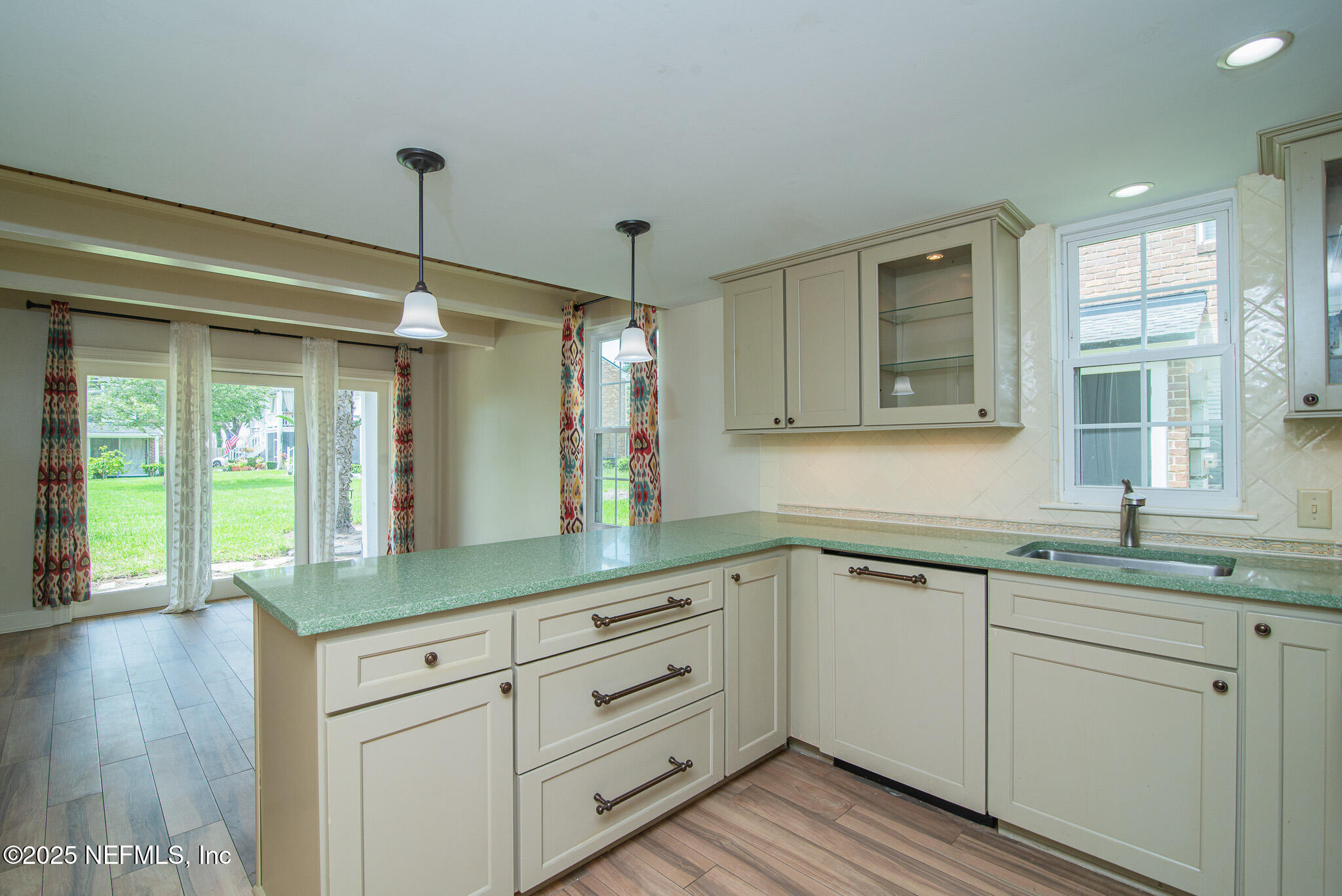 4358 Timuquana Road, Unit 148 Jacksonville, FL 32210 - Photo 5 of 22 a kitchen with sink cabinets and wooden floor