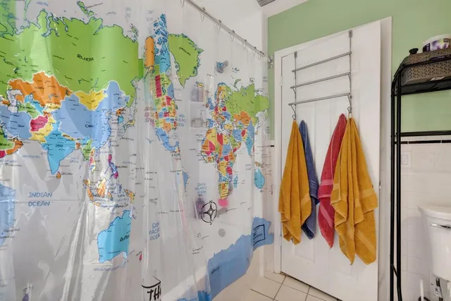 a view of walk in closet with clothes