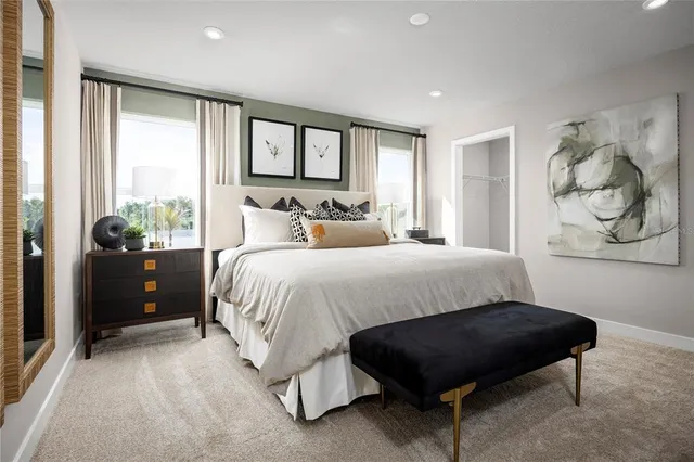 a bedroom with a bed and window