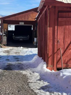 a view of a house with a snow in the yard