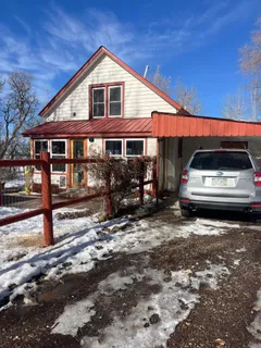 a view of car parked on the side of a road