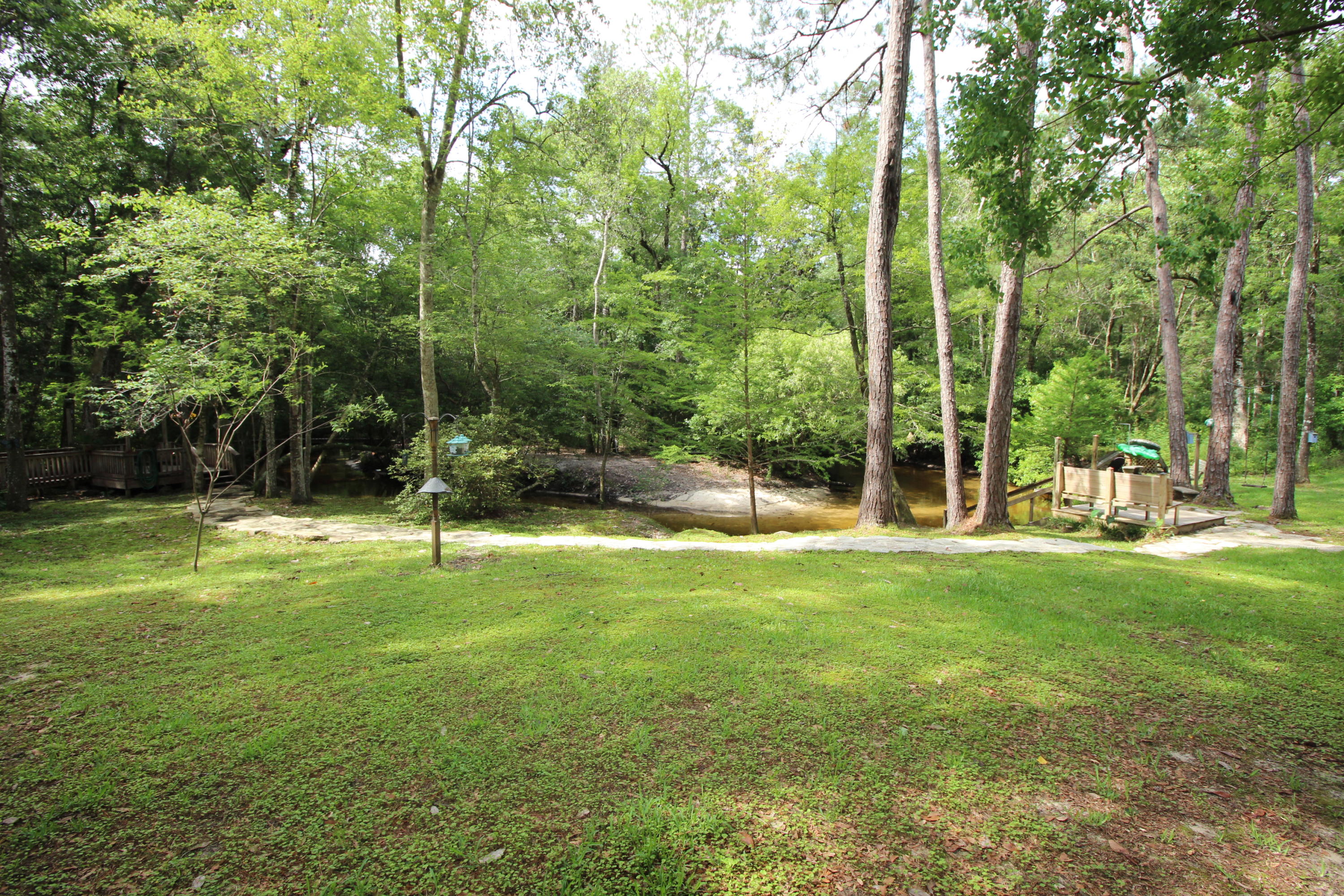 180 Tim Boland Road DeFuniak Springs, FL 32435 - Photo 50 of 85 a view of a house with a backyard