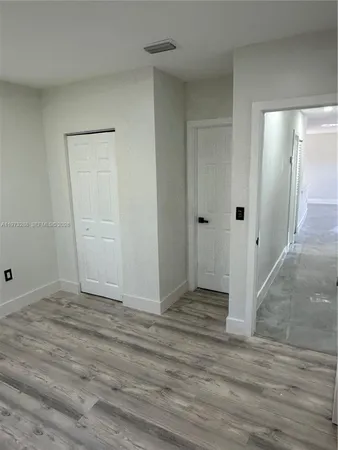 a view of entryway with wooden floor