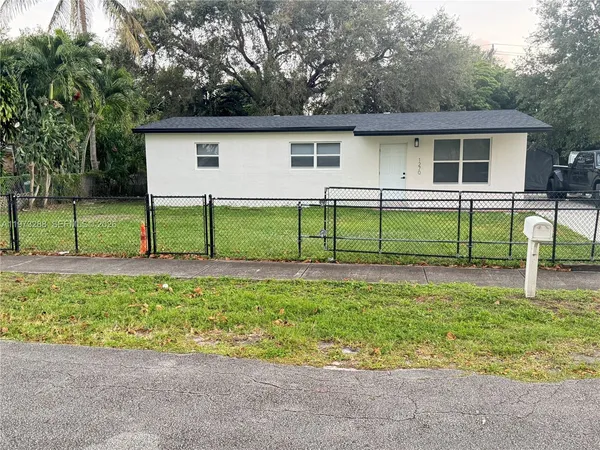 a front view of a house with a yard and porch