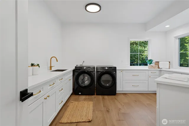 a kitchen with white cabinets and a stove