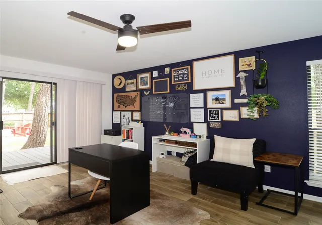 a backyard of a house with seating and tree