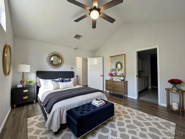 an empty room with wooden floor and ceiling fan