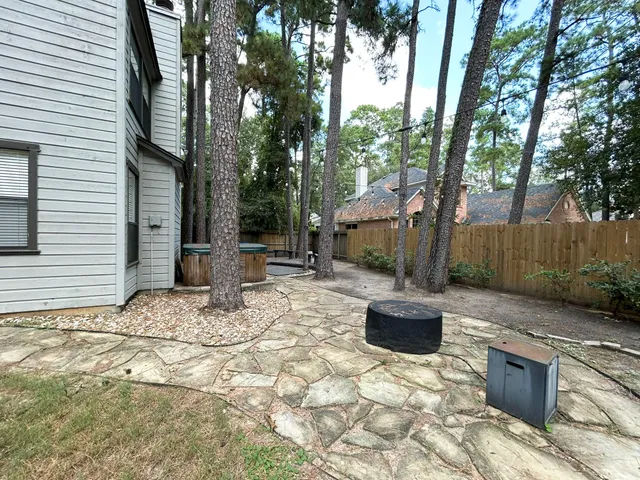 a view of a porch with a table and chairs in patio
