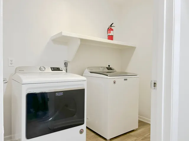 a utility room with dryer and washer