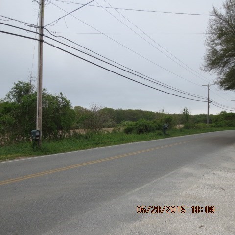 978 Sodom Road Westport, MA 02790 - Photo 4 of 9 a view of a road with a building in the background