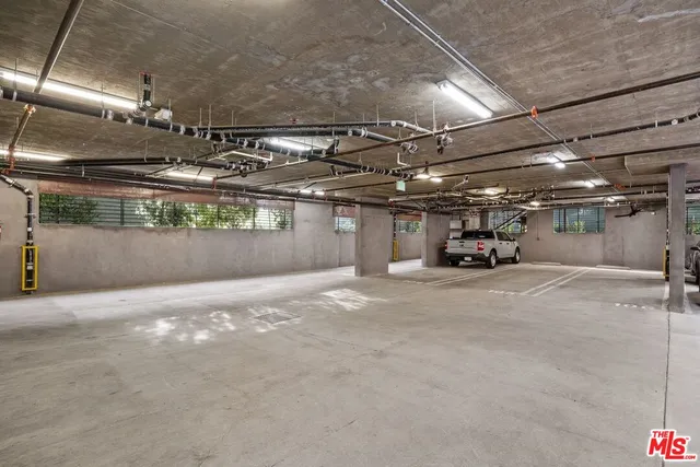 a view of parking garage with cars