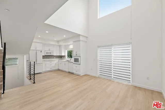 a view of kitchen with wooden floor