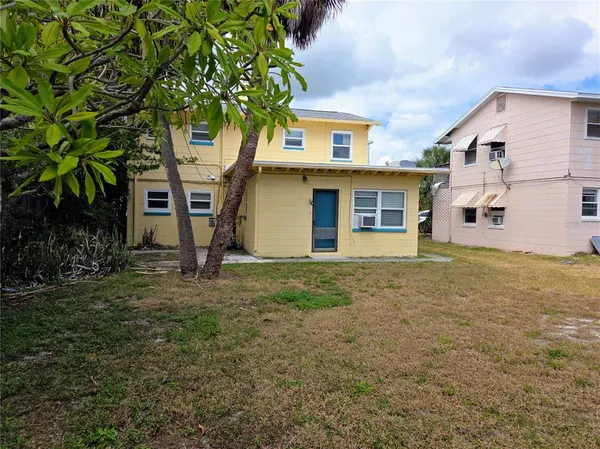 a house with trees in front of it