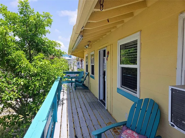 a view of balcony with wooden floor and outdoor space