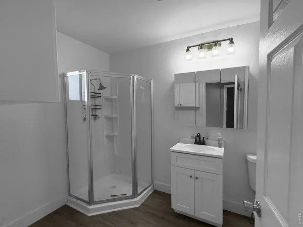 a bathroom with a sink a toilet and mirror