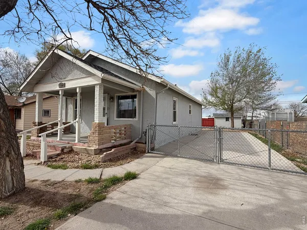 a house with trees in the background