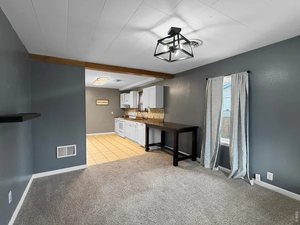 a view of a livingroom with a furniture and a chandelier