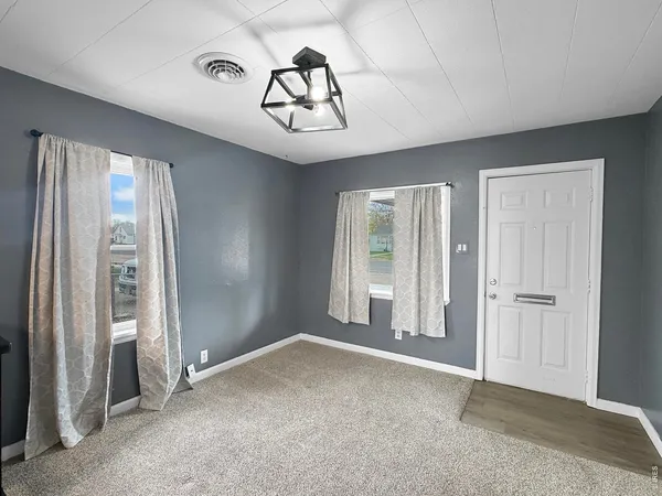 a kitchen with a sink a stove and cabinets