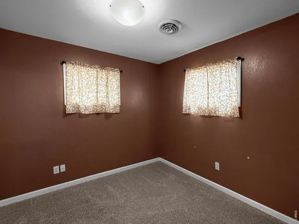 a bathroom with a double vanity sink mirror and shower