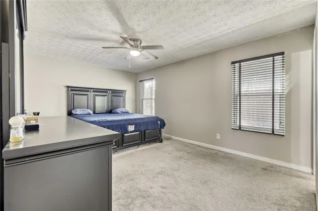 a room with furniture and a large window