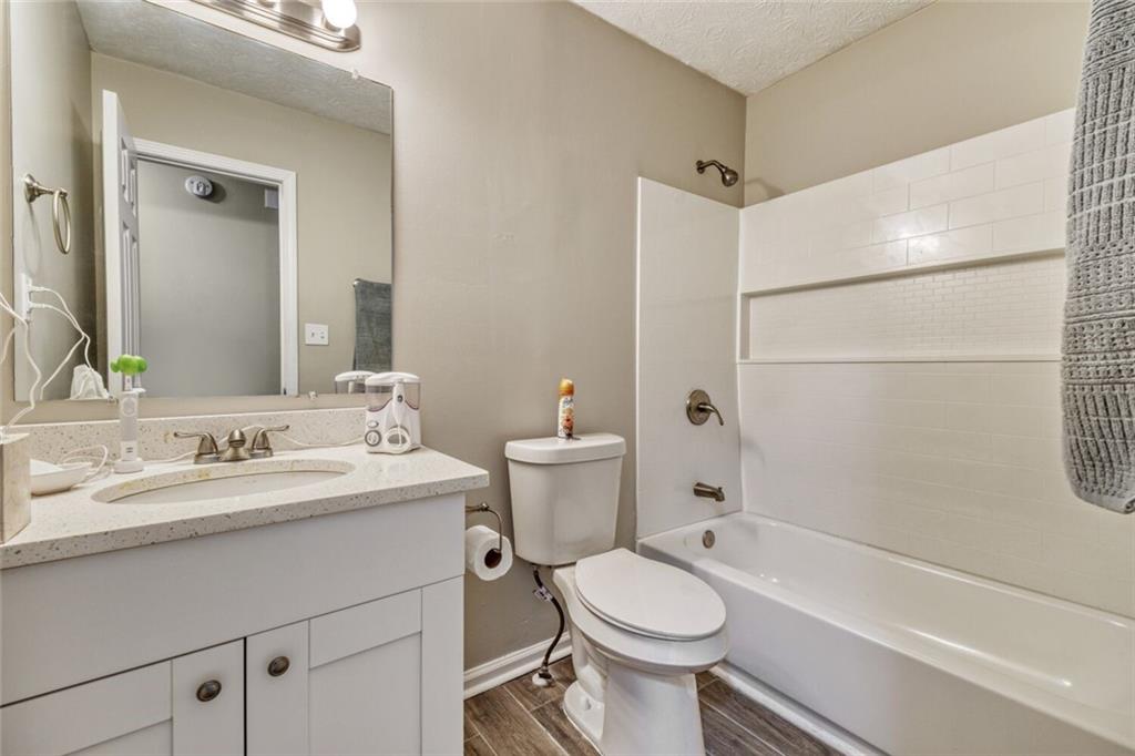 5544 Alpine Court Lithonia, GA 30038 - Photo 21 of 28 a bathroom with a sink a toilet and shower
