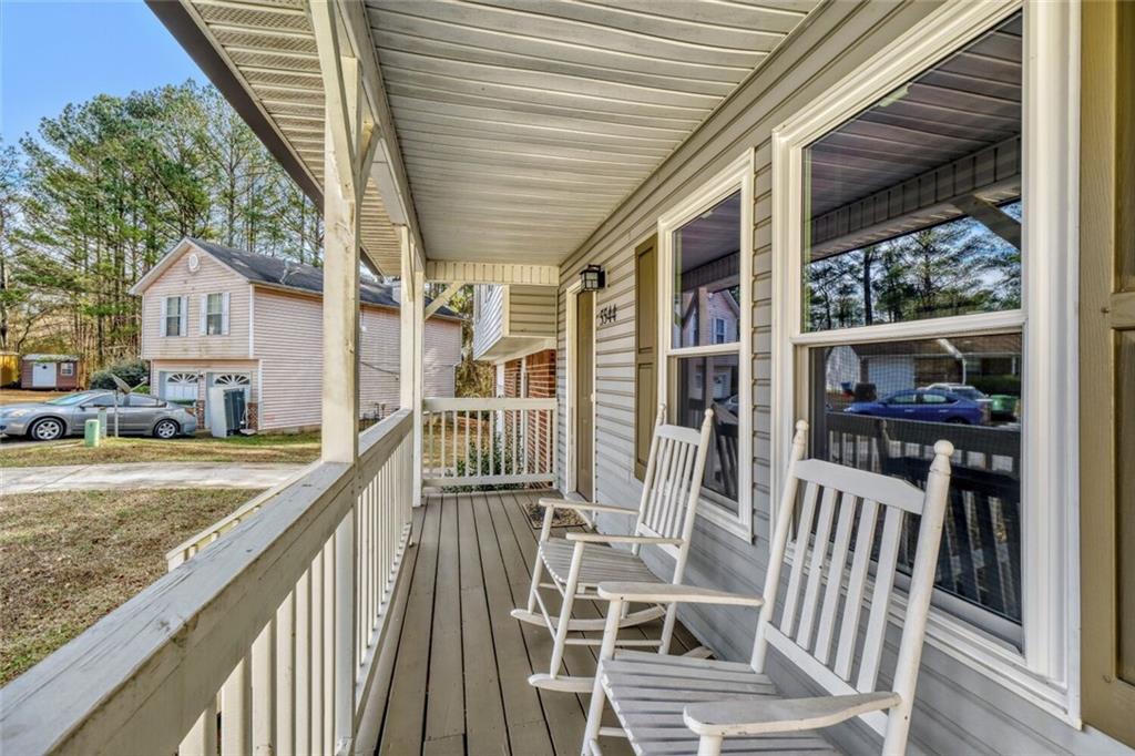 5544 Alpine Court Lithonia, GA 30038 - Photo 23 of 28 a view of a chair and tables in the balcony