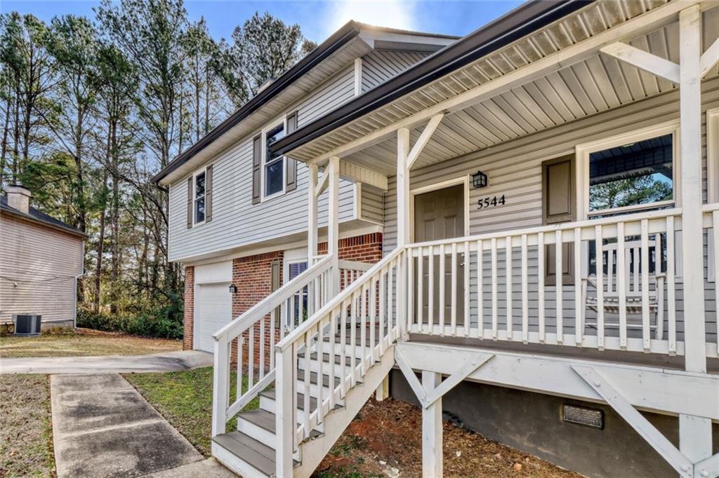 5544 Alpine Court Lithonia, GA 30038 - Photo 24 of 28 a view of a house with a deck