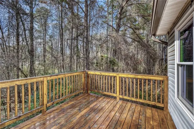a view of balcony with wooden floor