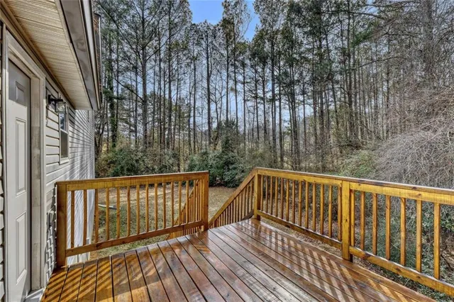 a view of balcony with wooden floor