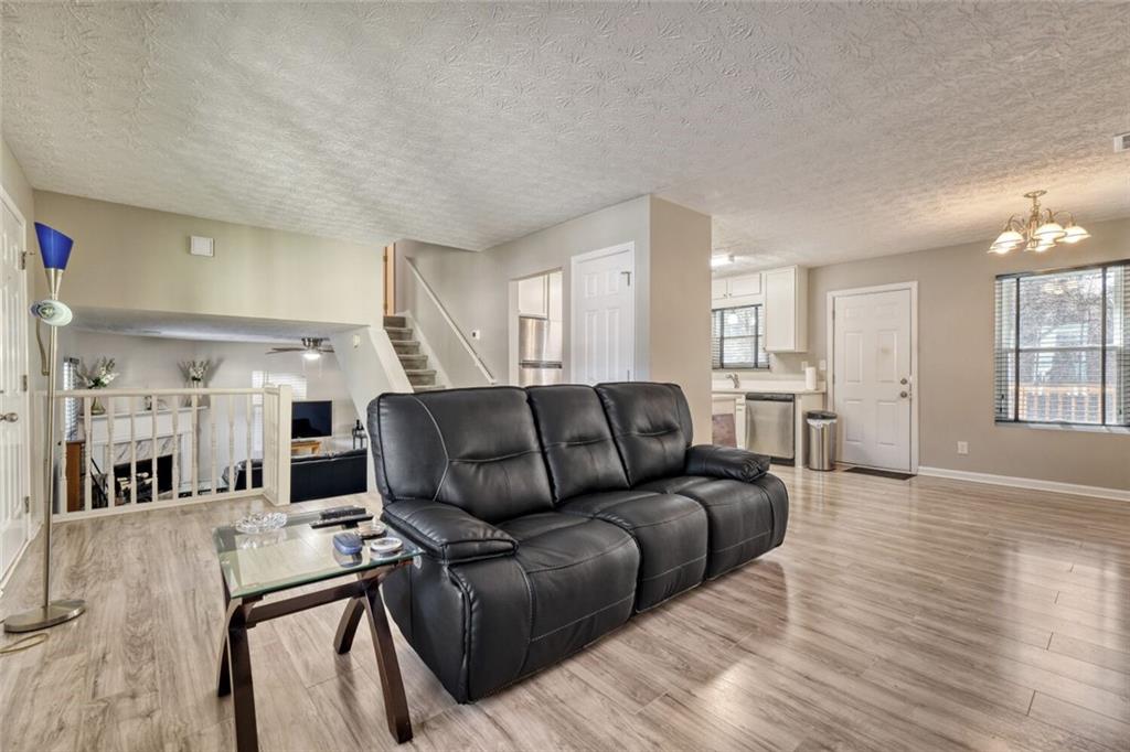 5544 Alpine Court Lithonia, GA 30038 - Photo 3 of 28 a living room with furniture and a wooden floor