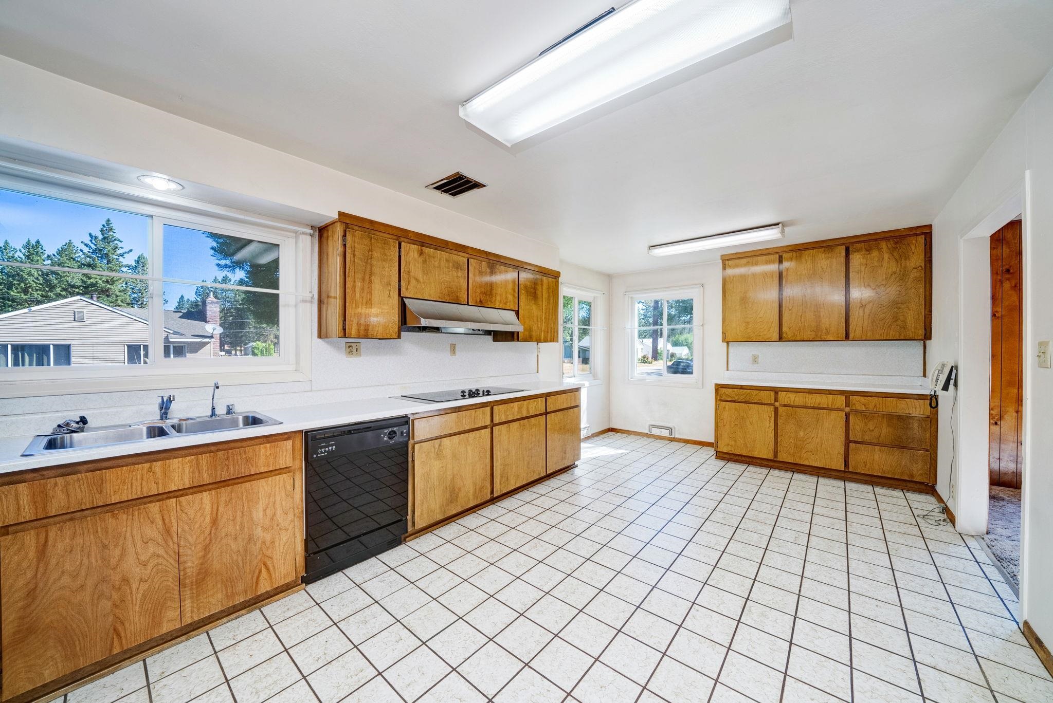 485 Ridge Street Portola, CA 96122 - Photo 8 of 27 a kitchen with stainless steel appliances a sink and counter space