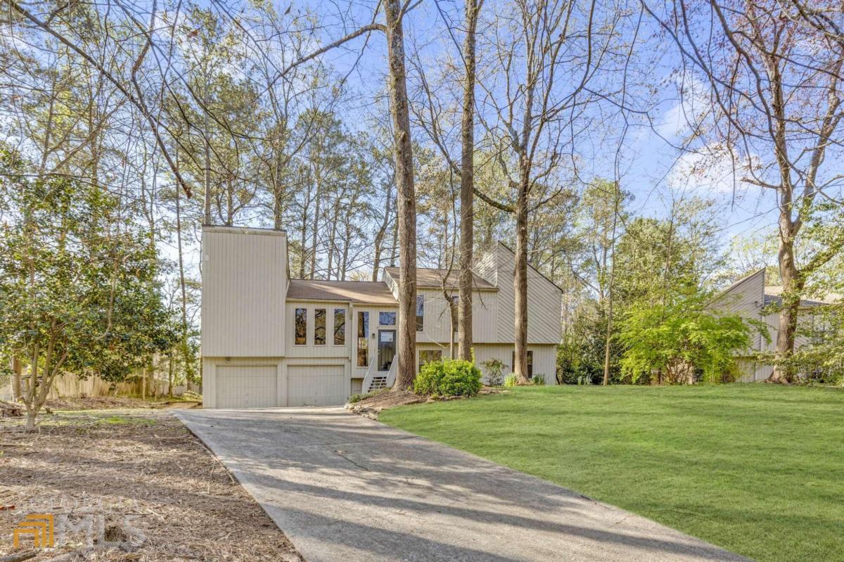 929 Leafwood Court Marietta, GA 30067 - Photo 1 of 1 a view of a building with a yard