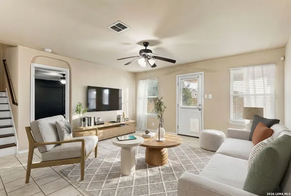 a living room with furniture and a flat screen tv