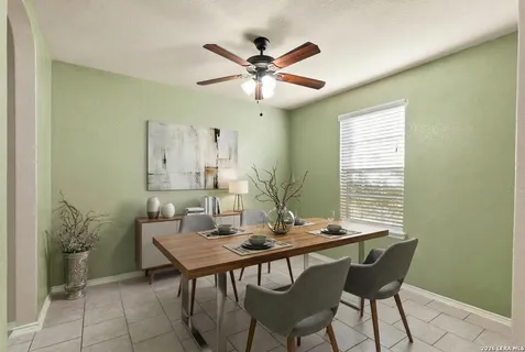 a dining room with furniture and window