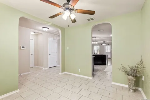 a view of a hallway with a bathroom