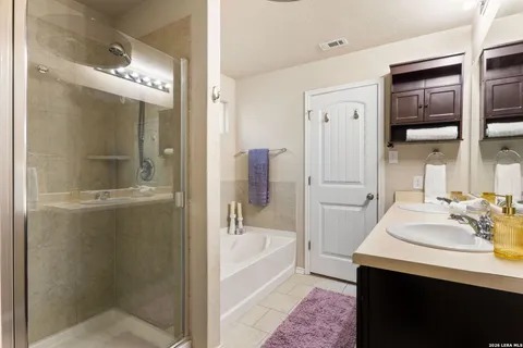 a bathroom with a bathtub and a sink