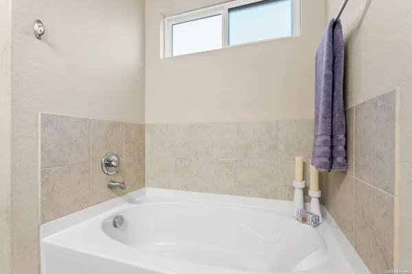 a white bath tub sitting in a bathroom