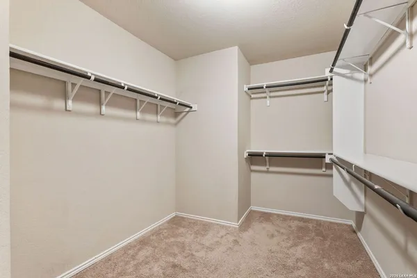 a view of an empty walk in closet