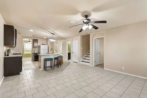 a view of kitchen with furniture and a chandelier