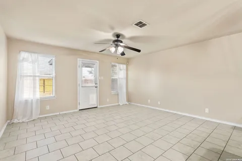 a view of an empty room and window