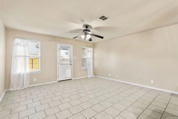 a view of an empty room and window