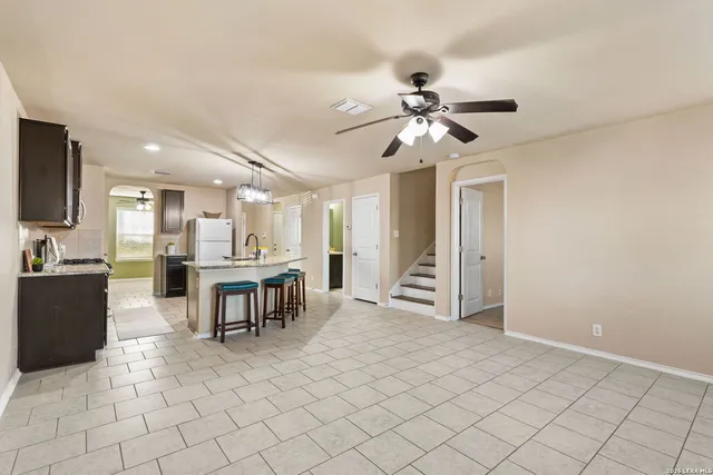 a view of kitchen with furniture and a chandelier