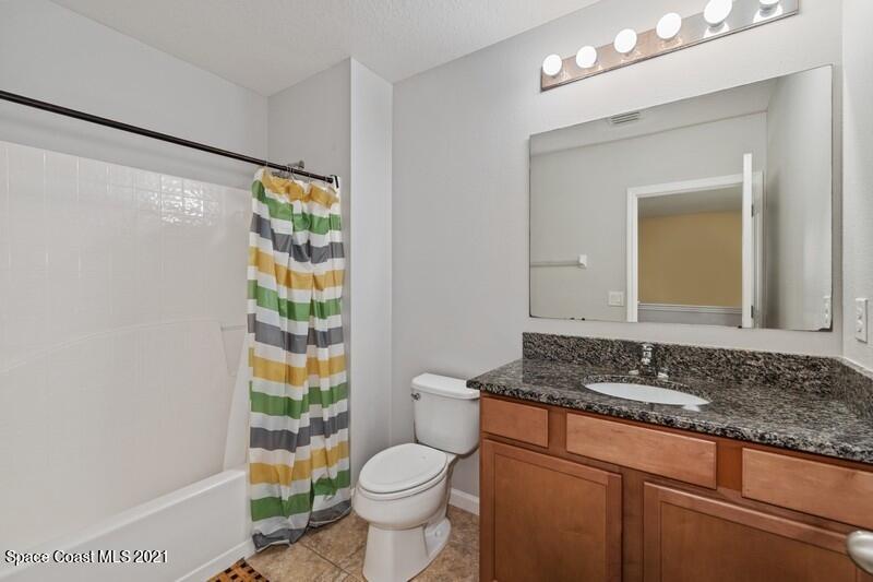 Undisclosed Address Melbourne, FL 32935 - Photo 11 of 17 11_2725RevolutionSt_101_8_Bathroom_FlexM